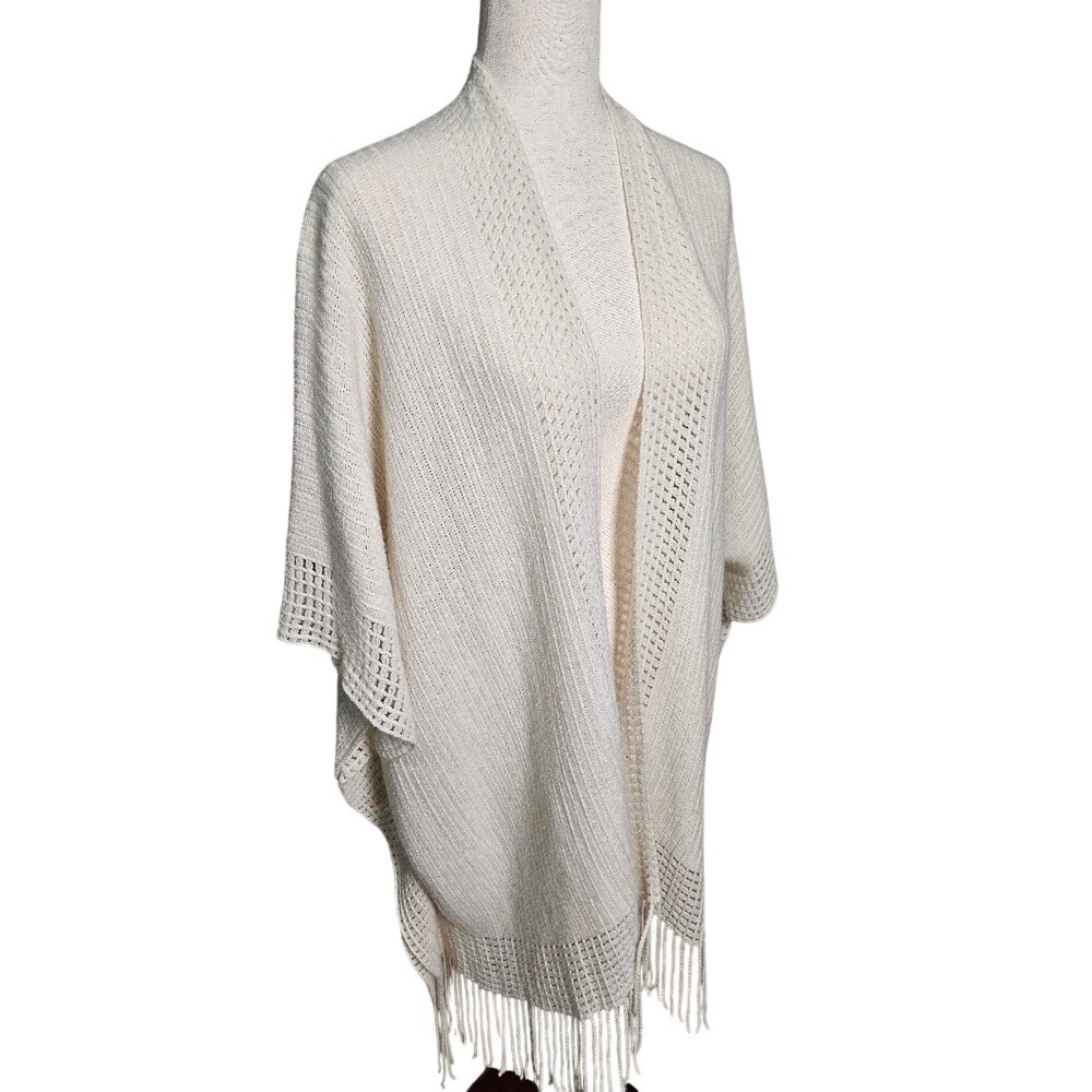 Cream Knit Kimono with open knit detail and tassles. Open no closure. One Size